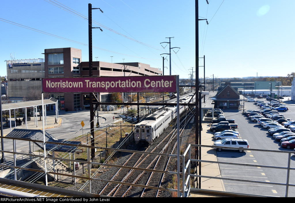 Septa train # 5210 departing the NTC with Silverliner IV Cab Car # 401 with the PC decal in the lead 